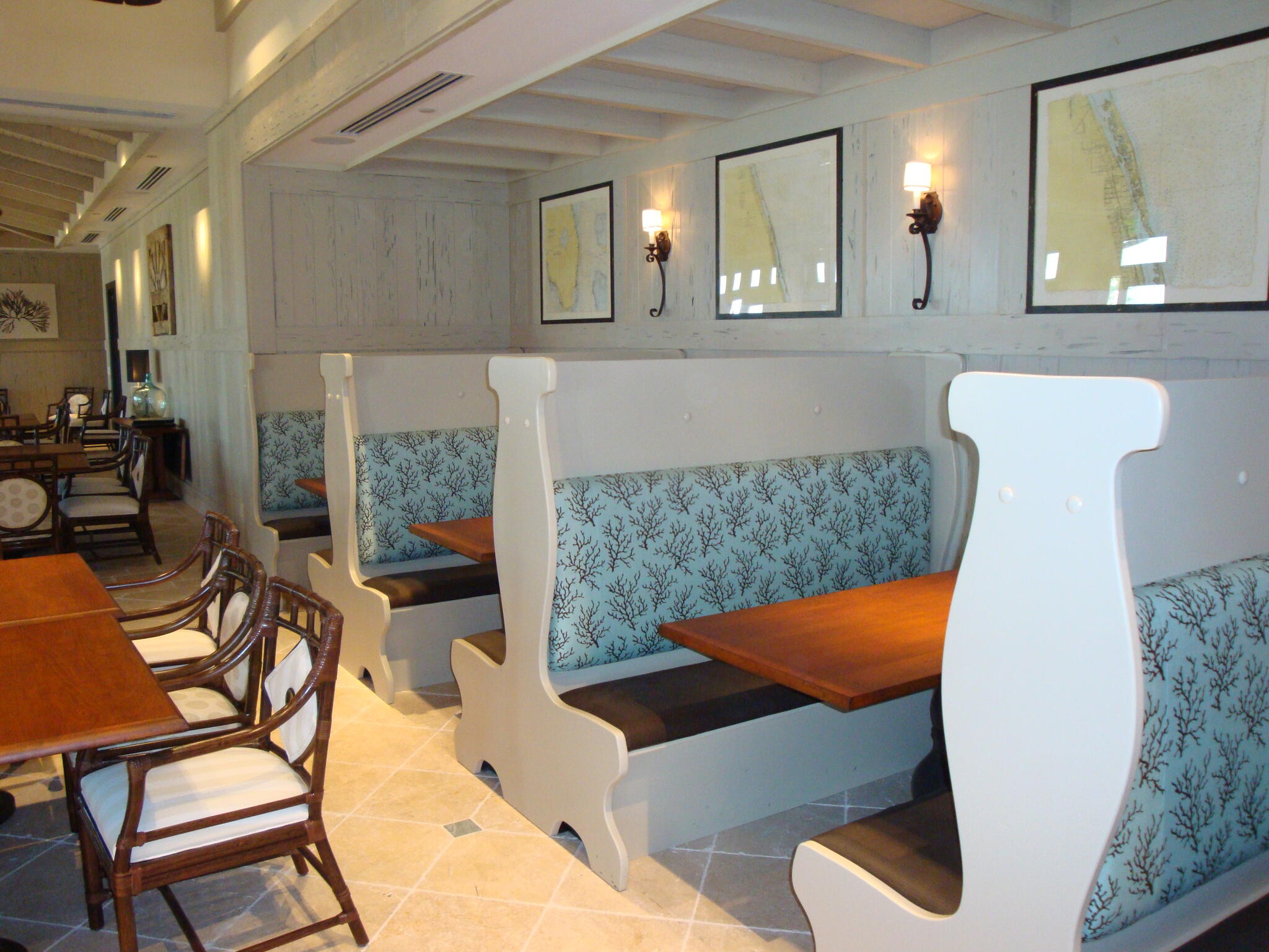 Pale blue patterned upholstery on built-in booth seating